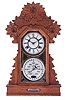 Charles W. Feishtinger, Fritztown, Pennsylvania, 8 days, time and strike spring brass movement double dial calendar shelf clock. These clocks were made by the Waterbury Clock Co. for Feishtinger, c1895.