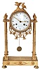 Feiver a Paris, France gilded brass architectural mantel clock, 8 days, time and bell strike, spring driven movement with silk thread suspension in a round case suspended above platform on four pad feet by four cast brass billars and surmounted by two doves. The white enamel dial is signed by maker.