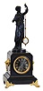 French, MYSTERY clock, time and bell strike, with Guilmet patent movement [signed], in a black marble case, accented with lions to the sides and with cast feet, the statue above carrying the glass lens pendulum, moving with no apparent impulse.