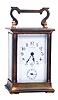 France, for Tiffany, 8 day time and alarm brass and beveled glass carriage clock.