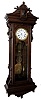 Wm. L. Gilbert Clock Co., Winsted, Conn., "Hanging Regulator No. 8" jeweler's regulator wall clock, 8 day, time only, brass weight driven movement in a walnut case with burled walnut panel and Jenny Lind top with a white enamel dial