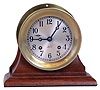 Chelsea Clock Co., Boston, Mass., 4" silvered dial screw bezel brass ship's bell marine clock on mahogany cradle, serial number 599151.