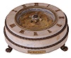 George Dorne, Turtle mystery clock, round, white marble basin with brass trim and reservoir, applied Roman numerals, and resting on cast brass paw feet, quartz movement, the turtle pointing to the time and controlled by a magnet attached to the movement