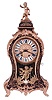 Tiffany & Co. bracket clock in the Louis XV style, 8 days, time and strike, spring driven movement in a case mounted with cast ornaments in the rococo style and enamel plaque with Tiffany signature, the top with putto, brass dial with Roman numeral cartouches