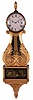 Unidentified New Hampshire or Massachusetts Lyre Banjo hanging clock with a weight driven 8 days time and strike movement in a mahogany and gilt case.