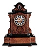 Johann Baptiste Beha, Germany, Black Forest shelf cuckoo. 8 day wood plate spring-driven movement with 6 tune Swiss music box in base, actuated by the clock movement. Case of burled walnut, finely inlaid with satinwood in a scrolling floral design. The wooden dial carries 12 porcelain cartouche with royal blue Roman Numerals. This model "No. 593" is illustrated in Justin Miller's book, Appendix A which is the Beha catalogue reprinted.