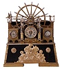 France, industrial series "Paddle Wheel" with alterations. Cast bronze, the mill wheel supported by two Ionic columns, and in a faux masonry mill race, driving two pistons flanking the 8 day timepiece, and with thermometer and barometer set in rectangular tanks at the right and left.