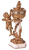 France, for Gubelin, Switzerland, desk clock with annular dial, gilt brass and marble, with rococo ornament, the urn form case supported on a stone column resting on a shaped base, and with a putto at left, holding an arrow used to indicate the time, Roman numeral silvered dial, 8 day timepiece movement with lever platform, movement signed