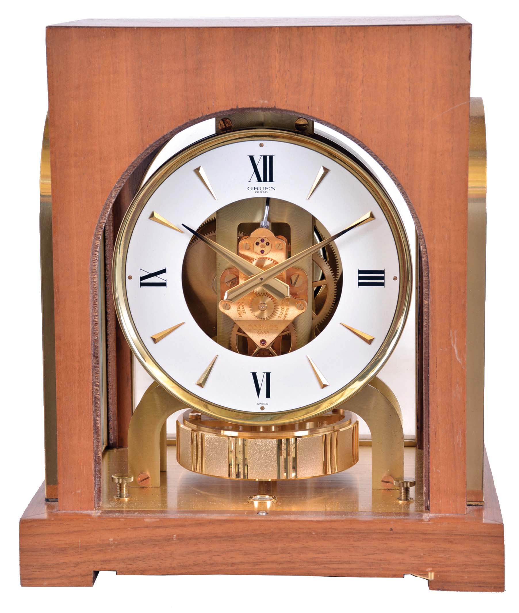 LeCoultre & Cie, Switzerland, for Gruen Guild / Cosmos Corp. "Atmos" clock, 15 jewel gilt caliber 528 movement, gilt torsion pendulum, round white painted dial with painted Roman numerals and gilt arrow markers, gilt hands with black tips, contained in a walnut veneered case with glazed, arched gilt frames — Antique Clocks Price Guide