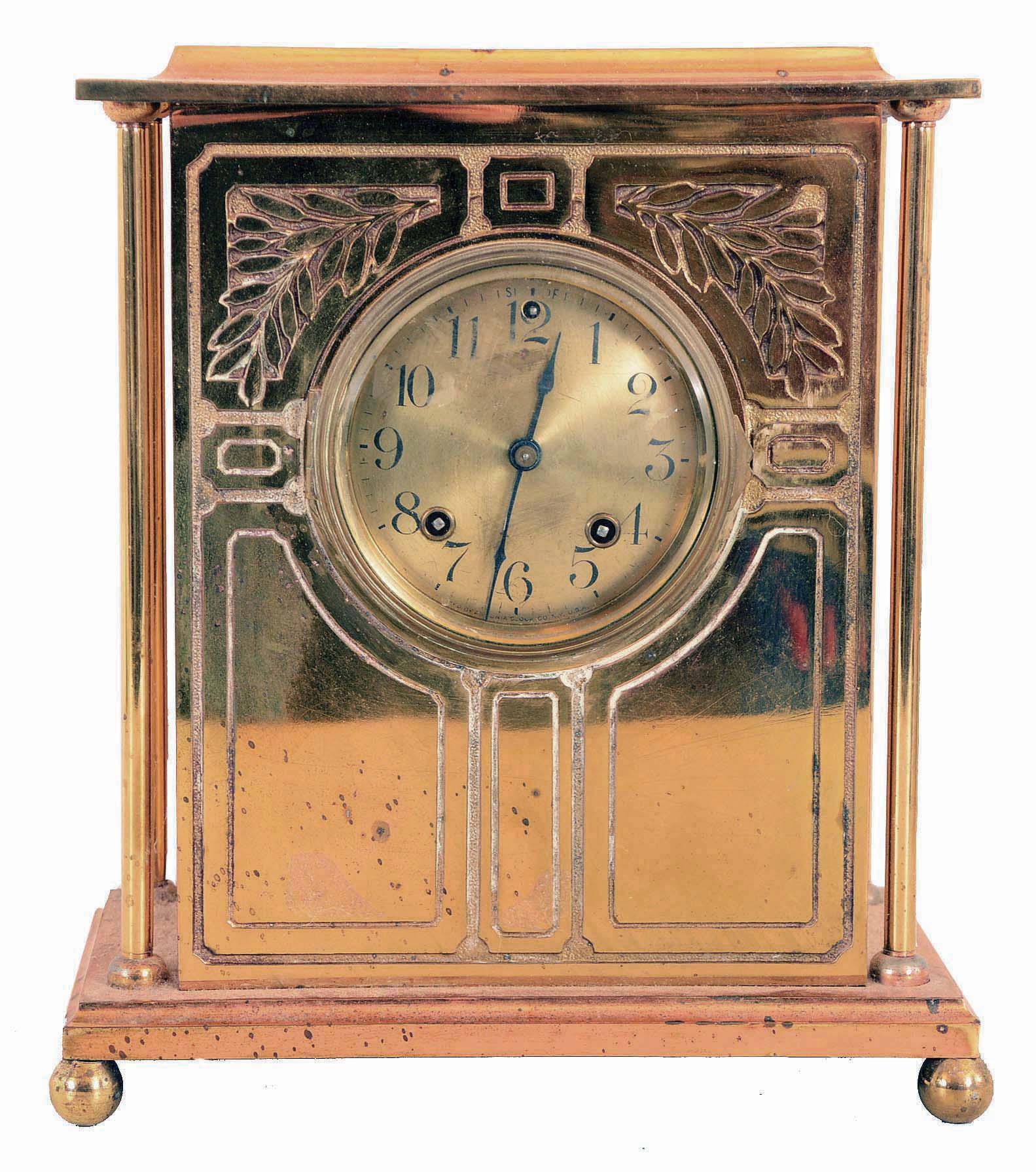 Ansonia Clock Co., New York, NY, "Sussex" mantel clock with a spring driven 8 days time & half hour strike movement in a brass plated case with four free standing columns. — Antique Clocks Price Guide