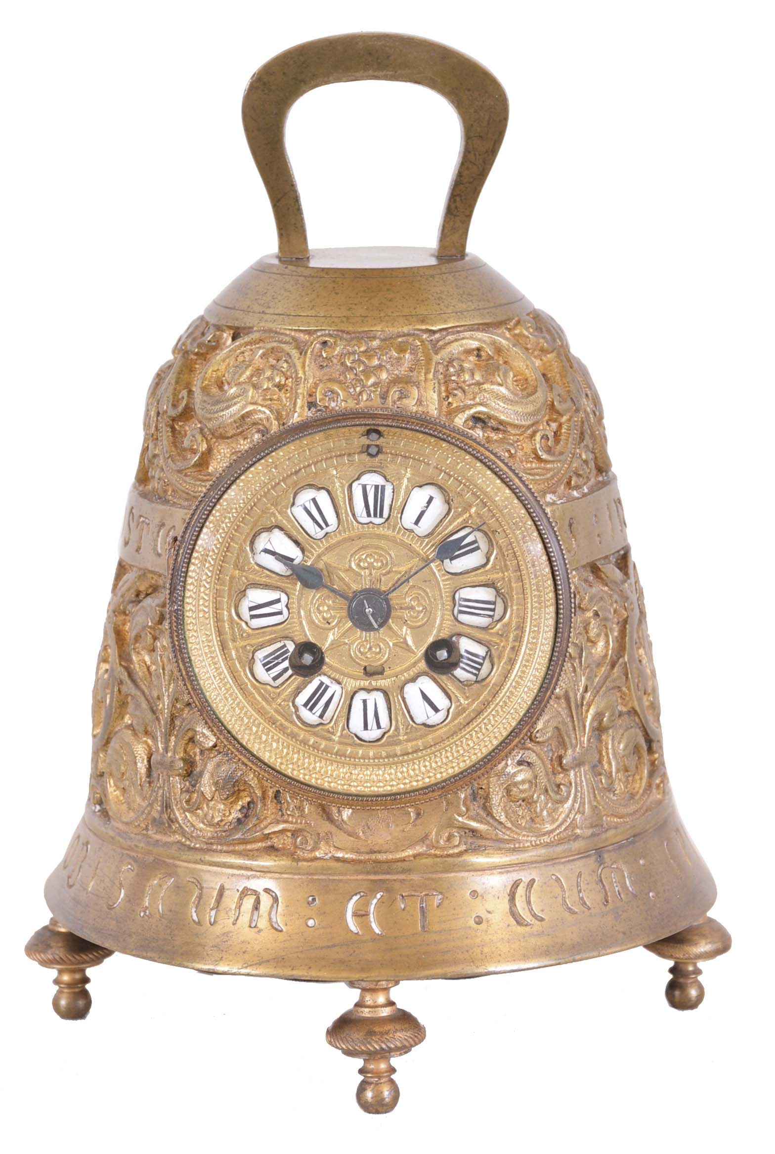 France, miniature brass bell form table clock, the cast, gilt case with foliate designs and human figures playing various musical instruments, and Latin phrases with religious significance, top with handle, and base with turned feet, cast bezel and dial with applied white enamel Roman numeral cartouches, blued steel hands, 8 day time and strike movement with cylinder platform, striking on a bell — Antique Clocks Price Guide