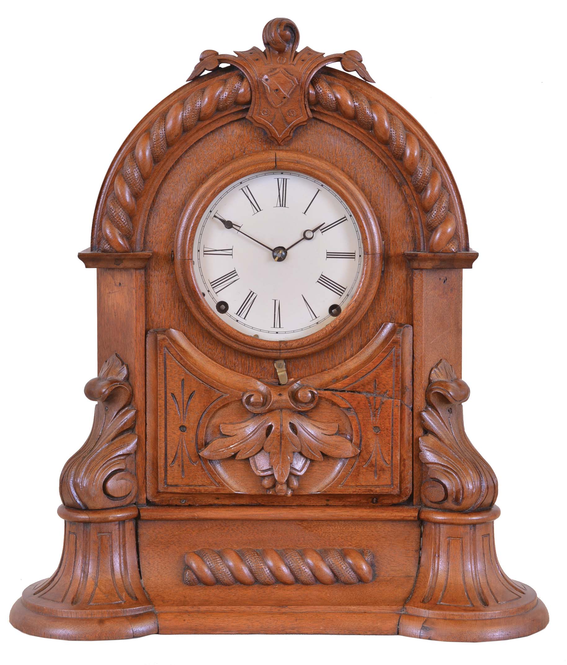 American Clock Co., 3 Cortlandt St. N.Y., shelf clock, walnut case with arch top, decorated with bold turned and carved elements, Roman numeral white enamel dial, blued steel hands, and 8 day time and strike Seth Thomas movement with lyre plates — Antique Clocks Price Guide