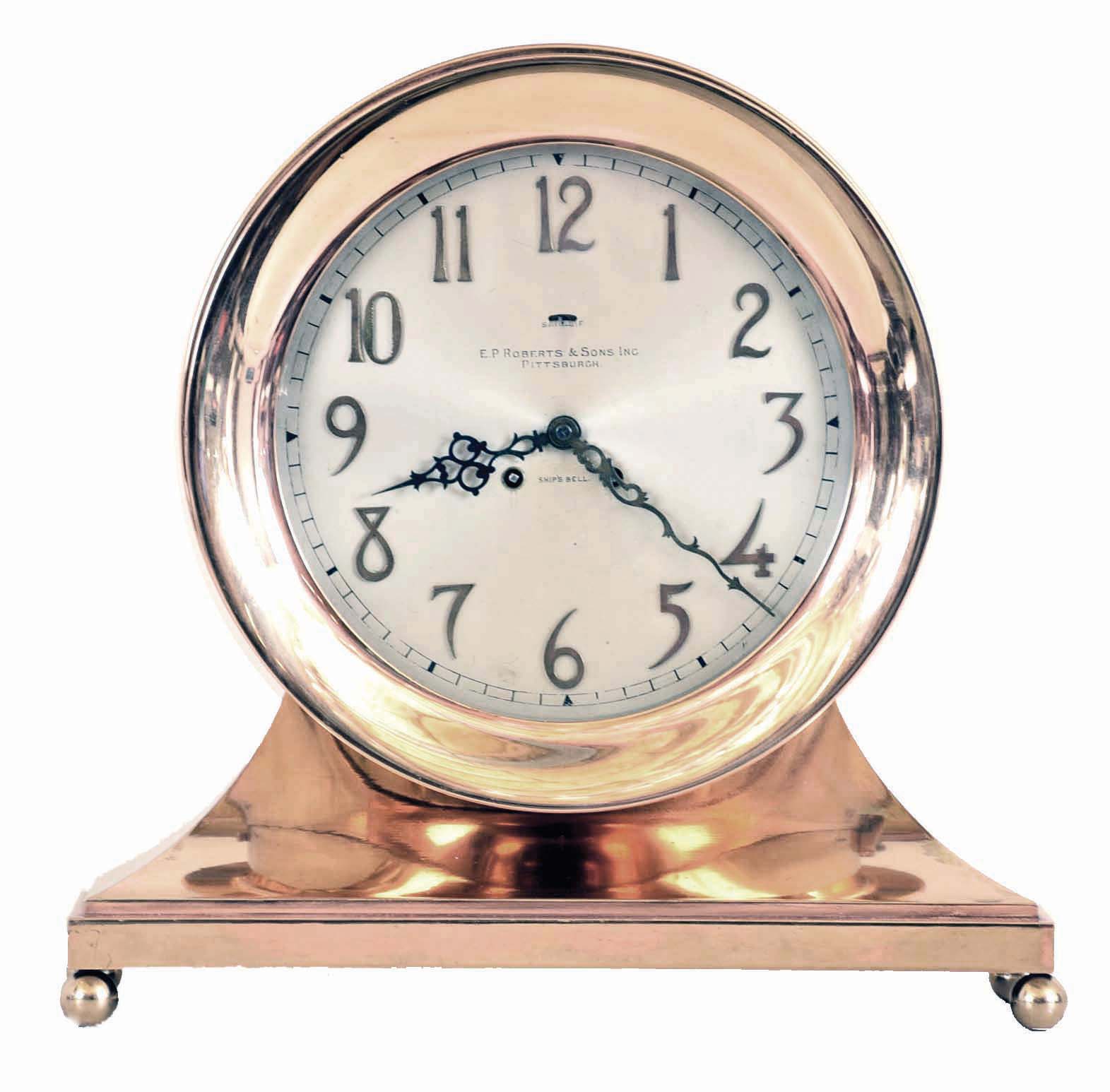 Chelsea Clock Co., Boston, Mass., Mass, a base and ball special "Commodore" ship's bell clock with ten inch dial {24.5cm}, in a red brass case with hinged bezel & button latch, retailed by E. P. Roberts & Sons, Pittsburgh as indicated on dial. — Antique Clocks Price Guide