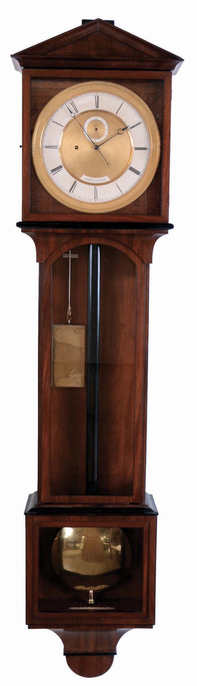 Laterndluhr, dial signed, Dorfer in Wien, Veinnese wall clock, period movement and pendulum now in a 20th Century European case of high quality.  Glazed mahogany and mahogany veneer case with ebonized moldings, gilt engine turned bezel, signed Roman numeral silvered dial with gilt, engine turned center, blued steel Breguet style hands, unusual 30 day timepiece movement consisting of a single, round plate, the wheels pivoted between this plate and individual cocks, deadbeat escapement, maintaining power, and steel coquerets on all mobiles, seconds beating brass clad pendulum with ebonized wooden rod, rectangular brass clad weight — Antique Clocks Price Guide