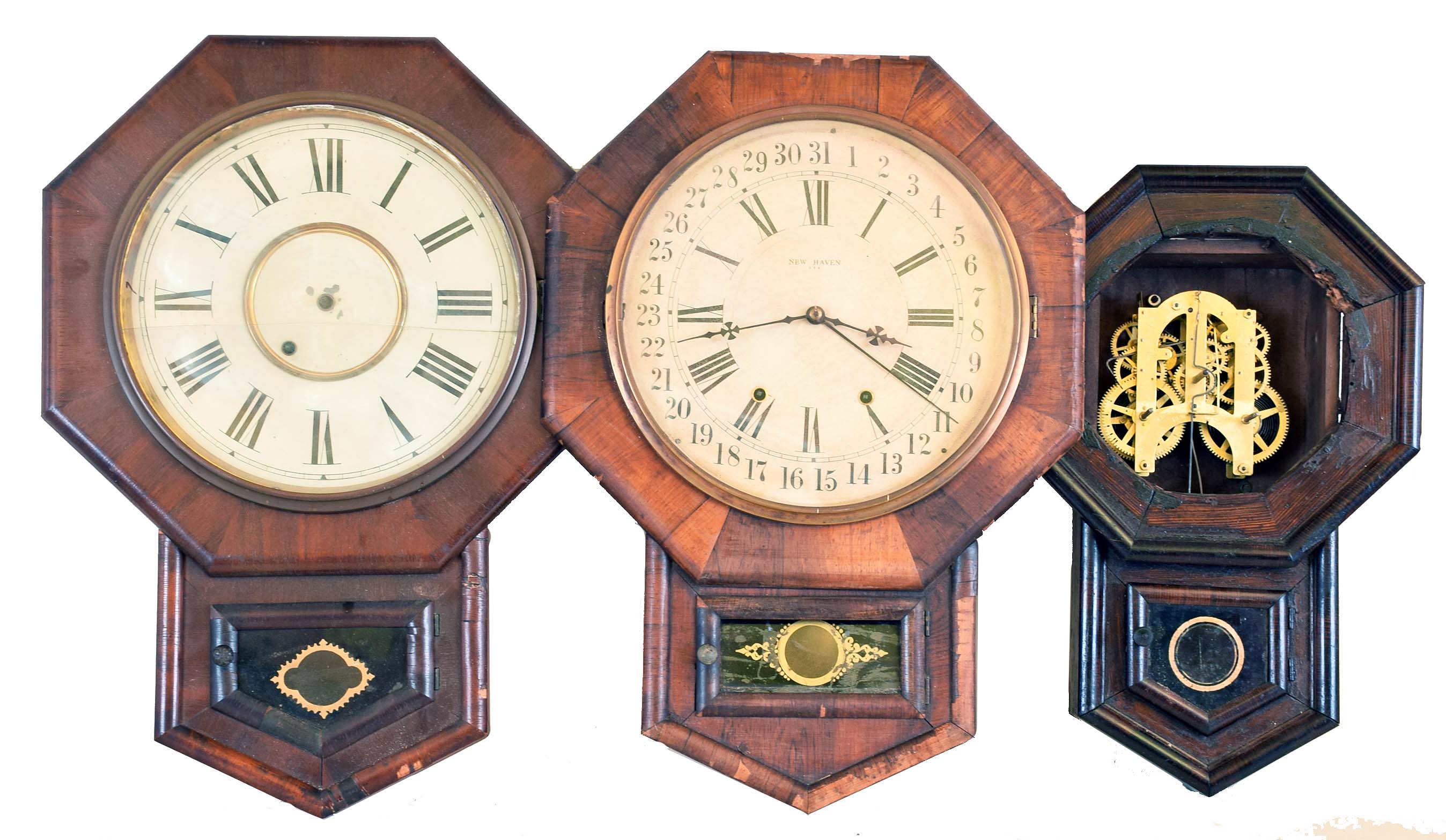 Clocks- 5 (Five): (1) New Haven Clock Co., New Haven, Conn., Short Drop wall hanging clock with a spring driven 8 day time, strike and simple calendar movement in a rosewood veneered case, c1890. (2) New Haven Clock Co., New Haven, Conn., Short Drop wall hanging clock with a spring driven 8 day timepiece movement in a mahogany veneered case, c1890, (3) New Haven Clock Co., New Haven, Conn. "Ventura" short drop wall hanging clock with a spring driven 8 day timepiece movement in a rosewood veneered case with advertising, c1890. (4) Ansonia Brass & Copper, Ansonia, Conn., Short Drop wall hanging clock with a spring driven 8 day time and strike movement in a rosewood veneered case, c1870. (5) Asian short drop wall clock with an Ansonia 8 day spring driven time and strike movement, c1890. — Antique Clocks Price Guide