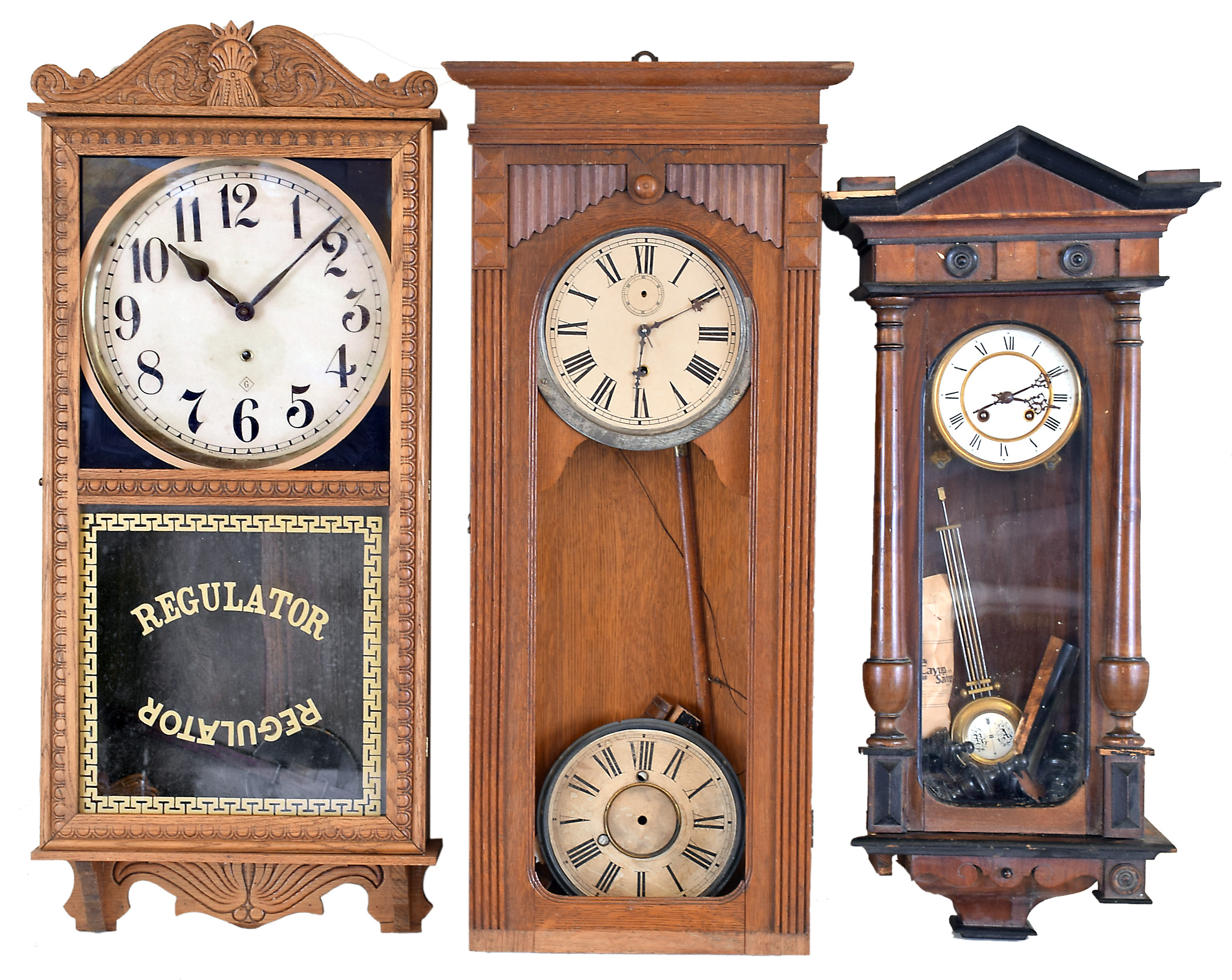 Clocks- 5 (Five): (1) Wm. L. Gilbert Clock Co., Winsted, Conn. "University" wall hanging clock with an 8 day spring driven timepiece movement in a mahogany case, c1913. (2) Sessions Clock Co., Forestville, Conn., "Regulator No. 1" wall hanging clock with an 8 day time and strike movement in an oak case, c1908. (3) Wm. L. Gilbert Clock Co., Winsted, Conn., unidentified wall hanging clock with an 8day timepiece movement in an oak case, c1910. (4) Wm. L. Gilbert Clock Co., Winsted, Conn, "Regulator No. 10" wall hanging clock with a double weight 8 day timepiece movement in an oak case, c1890. (5) German R- A Regulator wall clock with a spring driven 8 day time and strike movement, c1900. — Antique Clocks Price Guide
