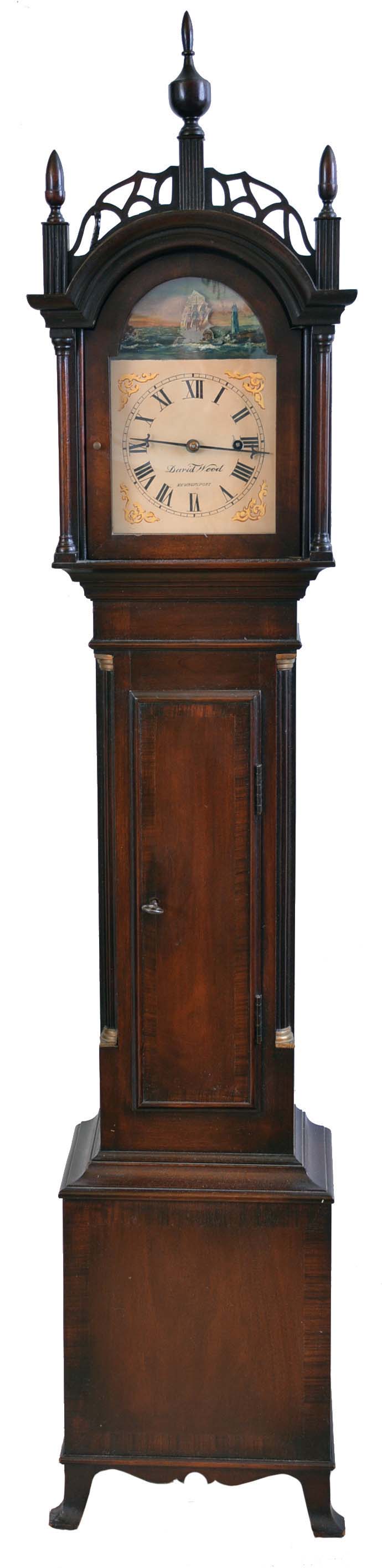 Dwarf tall clock, older reproduction, signed David Wood, Newburyport, Mass., 8 day, time only, weight driven movement in a Roxbury style banded mahogany case with painted metal dial with rocking ship. — Antique Clocks Price Guide