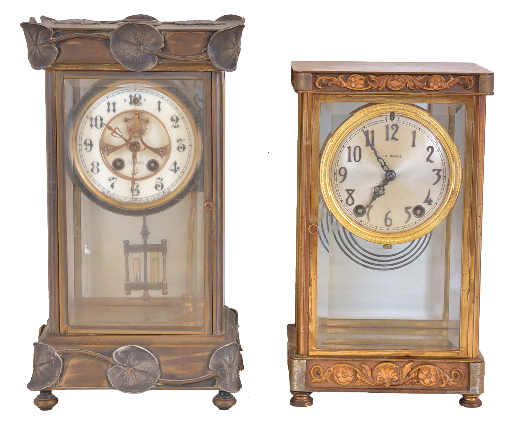 Clocks- 2 (Two): (1) Seth Thomas Clock Co., Thomaston, Conn., "Empire No. 4", 8 day, time and strike spring brass movement crystal regulator, c1904 (2) William L. Gilbert Clock Co., Winsted, Conn., "Falmouth", 8 day, time and strike spring brass movement crystal regulator, c1913 — Antique Clocks Price Guide