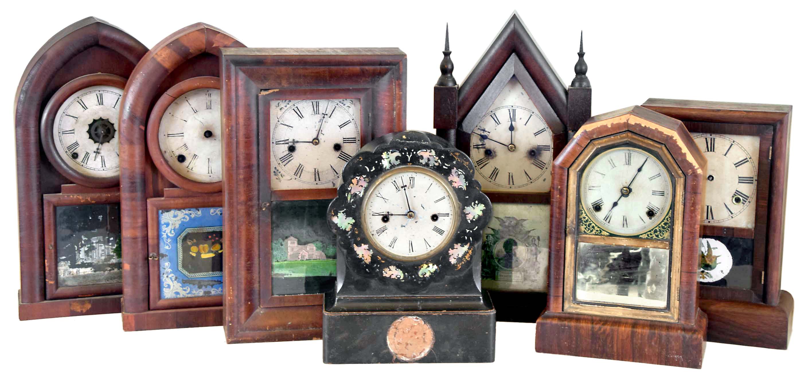 Clocks- 7 (Seven): (1) Unknown, 8 day, time and strike spring brass movement beehive clock, c1860 (2) Daniel Pratt & Sons, Reading, Mass., 8 day, time and strike spring brass movement beehive clock, c1850. (3) Waterbury Clock Co., Waterbury, Conn., 30 hour, time and strike spring brass movement Sharp Gothic or steeple clock, c1860. (4) Seth Thomas Clock Co.?, Thomaston, Conn. 8 day, time and strike spring brass movement shelf clock, c1865 (5) Chauncey Jerome, New Haven, Conn. 8 day, time and strike spring brass fusee movement shelf clock, c1850 (6) Ansonia Brass & Copper Co., Ansonia, Conn., 8 day, time and strike spring brass movement shelf clock, c1865 (7) Waterbury Clock Co., Waterbury, Conn., 30 hour, time and strike spring brass movement OG shelf clock, c1865 — Antique Clocks Price Guide