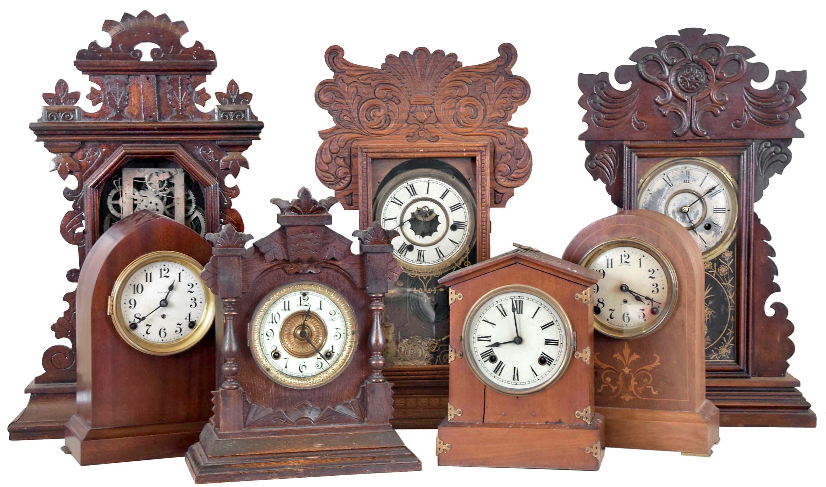 Clocks- 7 (Seven): (1) Waterbury Clock Co., Waterbury, Conn., 8 day, time, strike and alarm spring brass movement shelf clock, c1900 (2) New Haven Clock Co., New Haven, Conn., 8 day, time and strike spring brass movement shelf clock, c1890 (3) E. Ingraham & Co., Bristol, Conn., 8 day, time and strike spring brass movement shelf clock, c1890 (4) Ansonia Clock Co., New York, NY 8 day, time and strike spring brass movement cabinet series shelf clock, c1890 (5) Seth Thomas Clock Co., Thomaston, Conn., 8 day, time and strike spring brass movement round top mantel clock, c. 1910. (6) New Haven Clock Co., New Haven, Conn., 8 day, time and strike spring brass movement mantel clock, c1905 (7) Seth Thomas Clock Co., Thomaston, Conn., 8 day, time and strike spring brass movement beehive mantel clock, c1910 — Antique Clocks Price Guide