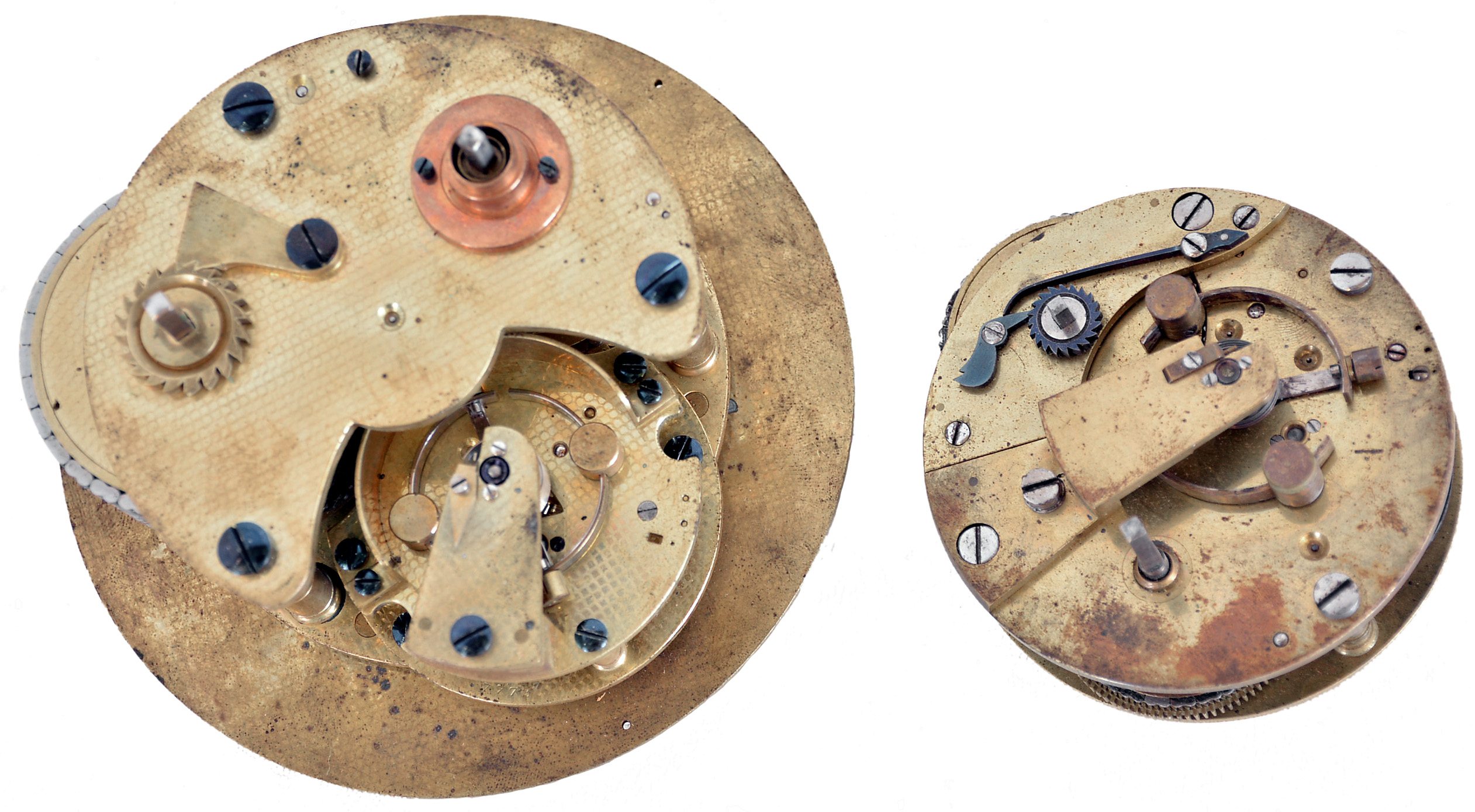Chronometer movements- 2 (Two), the first an eight day with spotted plates, reverse fusee, Z balance, and helical hairspring, the other a two day, also with Z balance and helical hairspring, together with a chronometer winding key, and a set of gold chronometer hands — Antique Clocks Price Guide