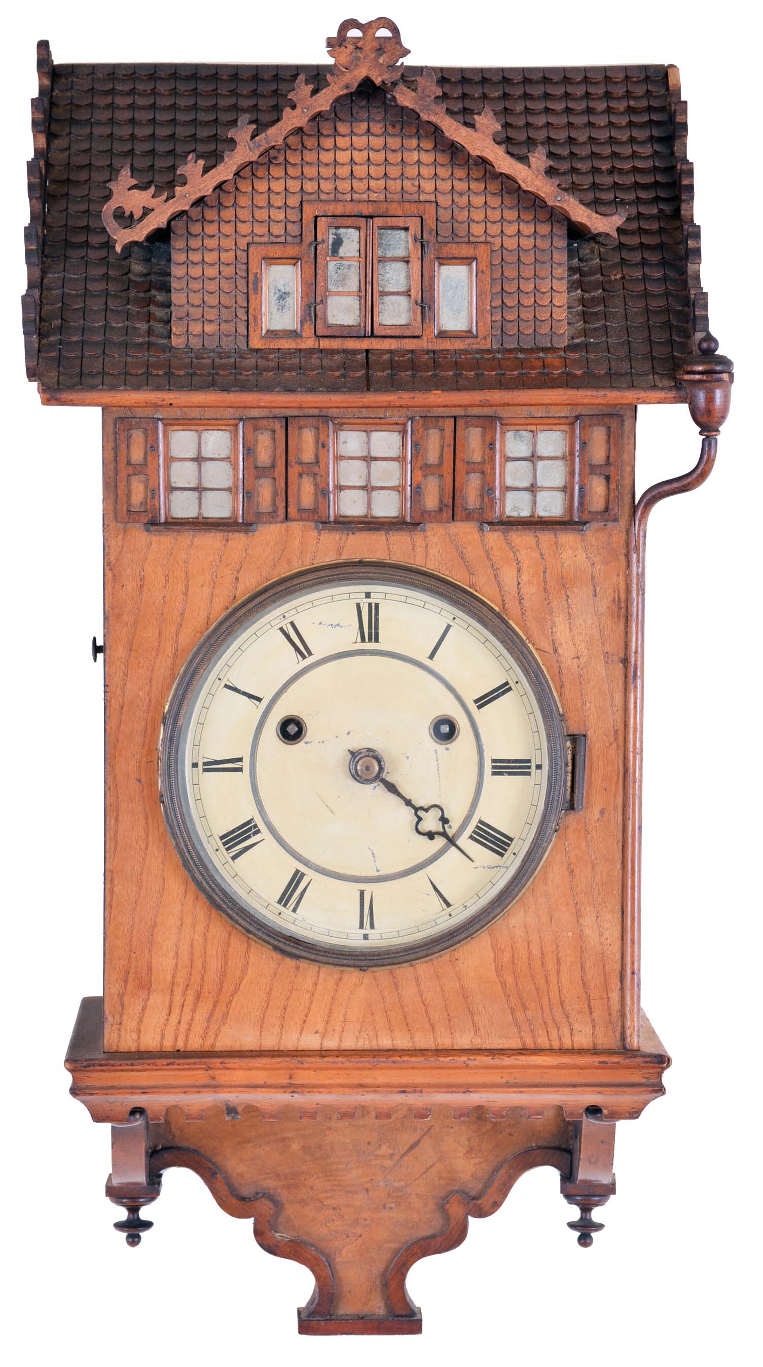 Johann Baptiste Beha, Eisenbach, a rare 8 day "Herrenhausle" hanging cuckoo, the architectural case with curly ash veneer and walnut trim, roof with carved shingles and the sash backed with mirrored glass, Roman numeral painted metal dial, blued steel hands, 8 day, two train fusee movement with wooden plates, heavy brass clad pendulum, and large, full bodied cuckoo — Antique Clocks Price Guide