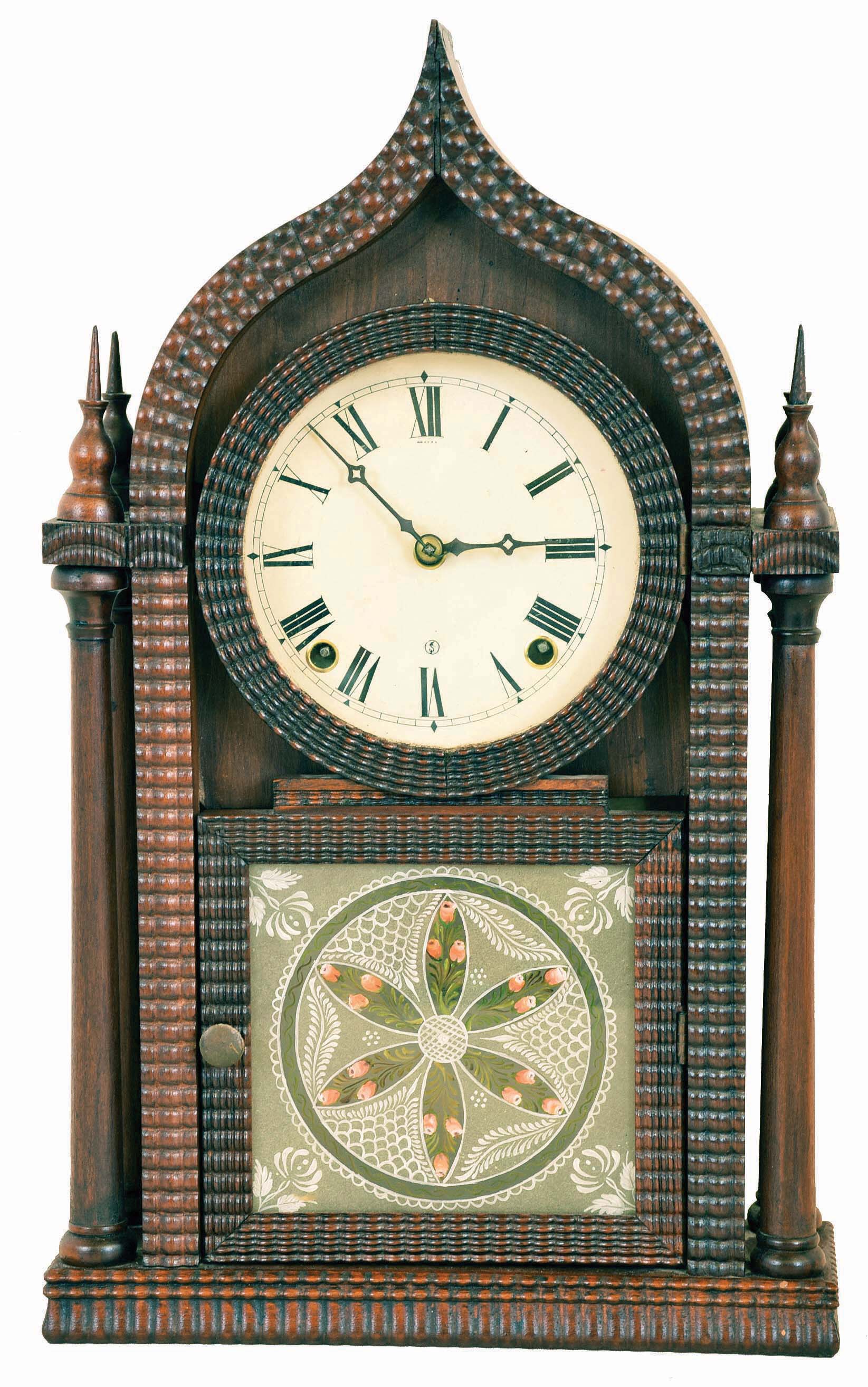 E. N. Welch, Forestville, Conn., "Oriental Gothic 4 Column" shelf clock with a spring driven 8 day time & strike brass movement in a ripple front rosewood case with mahogany columns. — Antique Clocks Price Guide