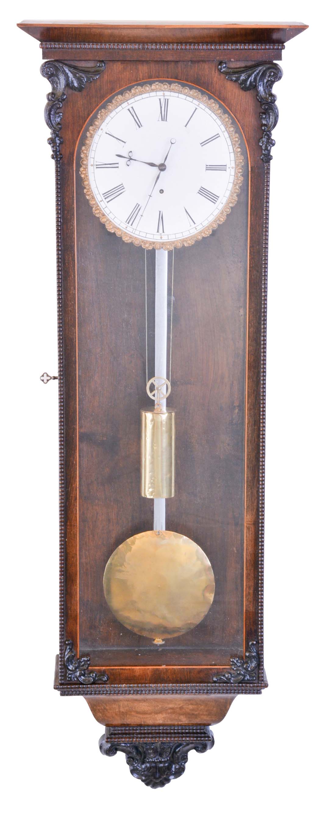 Austria, month going regulator in the Biedermeier style, rosewood veneered case with contrasting fine banding and beveled cornice molding, ripple moldings and applied, cast ornaments, one piece Roman numeral enamel dial with well cast & gilt bezel, finely cut blued steel hands, 30 day timepiece movement, brass pendulum with steel rod, and brass weight — Antique Clocks Price Guide