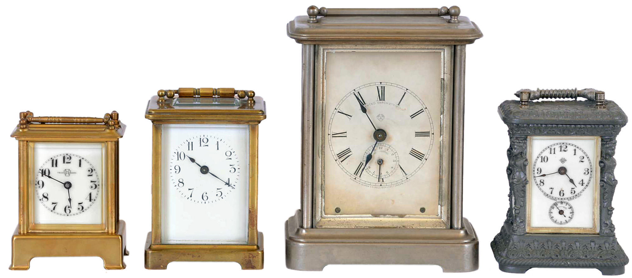 Clocks- 4 (Four),Carriage: the first a French timepiece with lever platform, the next an Ansonia timepiece with alarm, the third a Waterbury time and strike with repeat, an d the last an Ansonia Peep O Day timepiece with musical alarm — Antique Clocks Price Guide