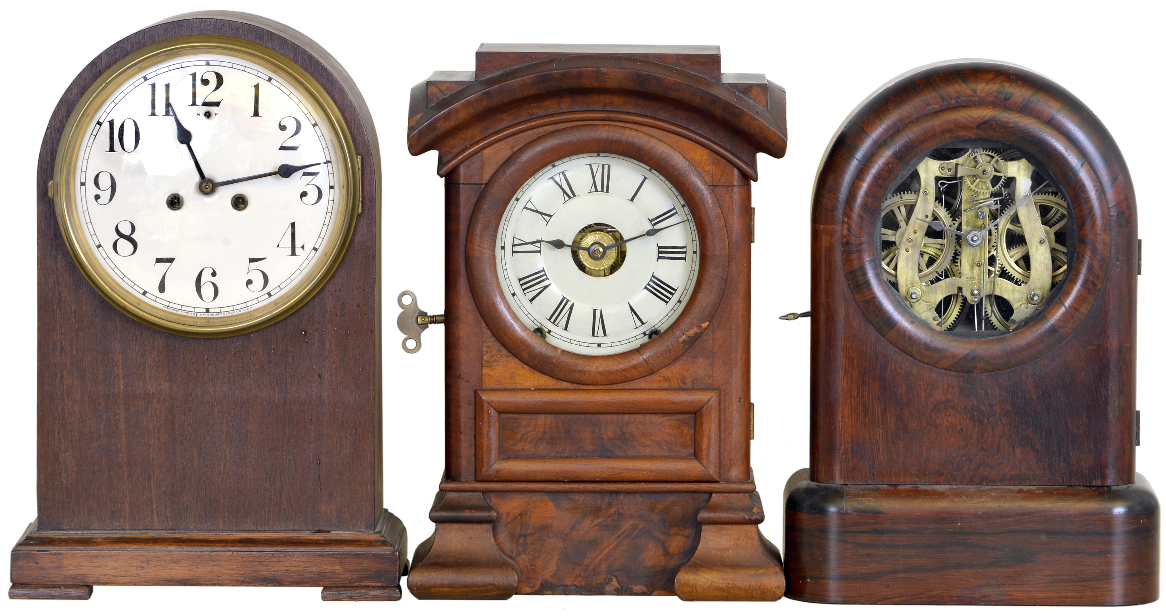 Clocks- 3 (Three): (1) Seth Thomas Clock Co., Thomaston, Conn., "Tudor No. 1" shelf clock with an 8 day spring driven time and strike lyre movement in a rosewood case, c1870 (2) Seth Thomas Clock Co., Thomaston, Conn., "Arch Top" model shelf clock with an 8 day spring driven time, strike and alarm movement in a walnut case, c1875. (3) Waterbury Clock Co., Waterbury, Conn., "Birmingham" model shelf clock with as 8 day spring driven time and half hour strike movement in a mahogany case, c1920. — Antique Clocks Price Guide