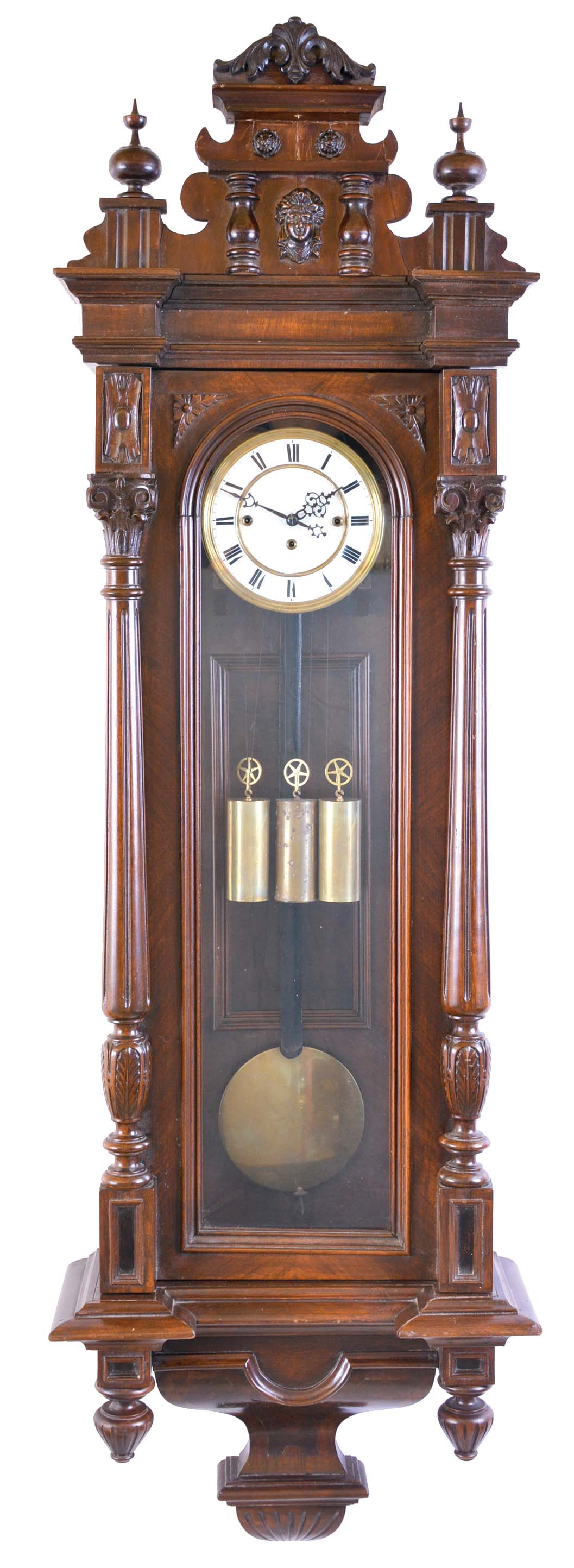 Austria, grand sonnerie striking regulator, beech and walnut case, door with fluted and carved columns, molded top with removable crest, and base with veneered bracket and turned drops, Roman numeral, two piece white enamel dial, blued steel hands, 8 day, three train, quarter striking movement, brass pendulum with wooden rod, and brass weights — Antique Clocks Price Guide