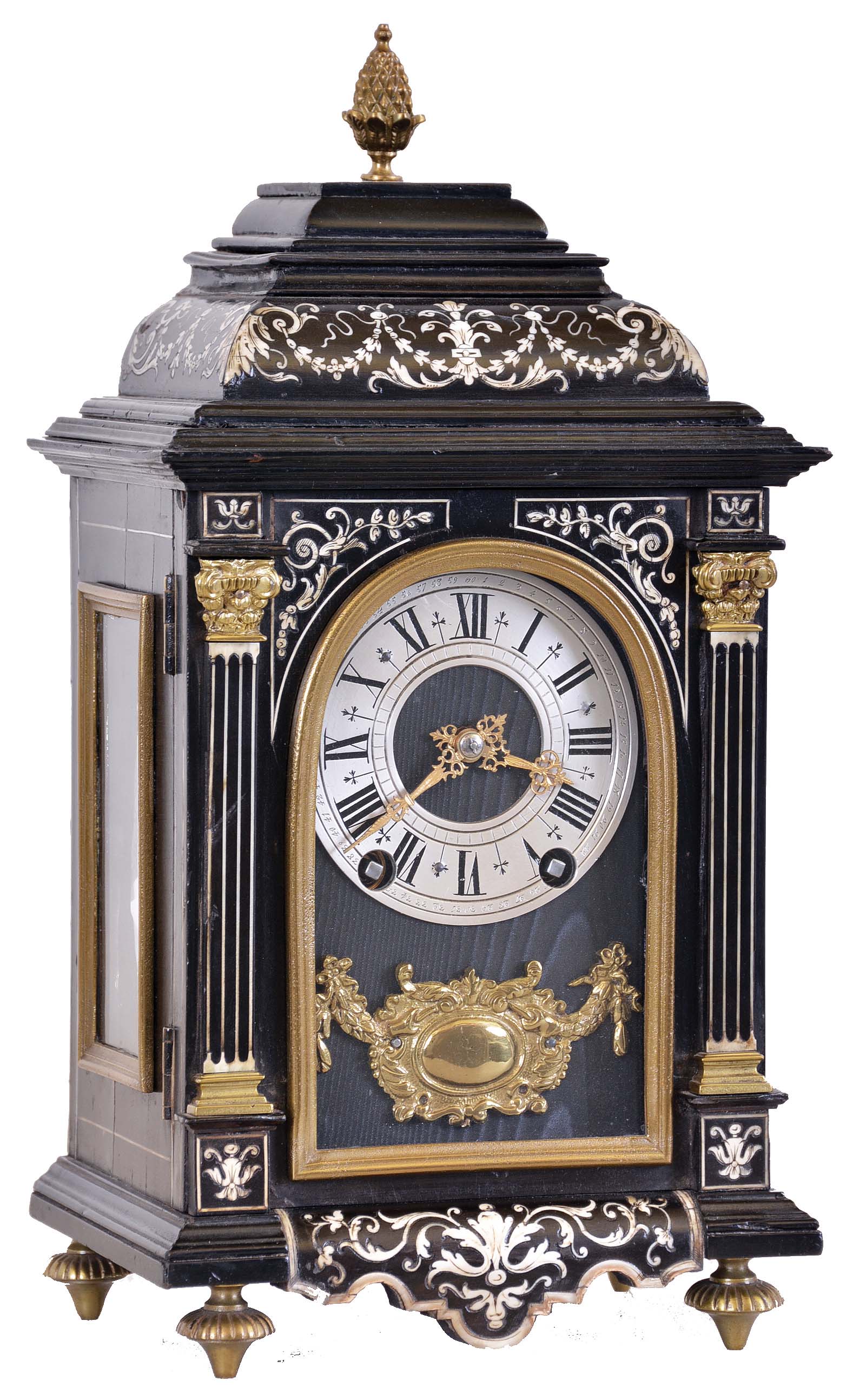 France, for W. Johnson & Son, London, miniature bracket clock, ebonized case with contrasting leaf, vine, and bellflower inlay, front with inlaid pilasters flanking the arched glass, Roman numeral silvered dial with fancy gilt hands, above a gilt ornament with central cartouche, all on a black moire ground, 8 day time and strike movement with square plates — Antique Clocks Price Guide