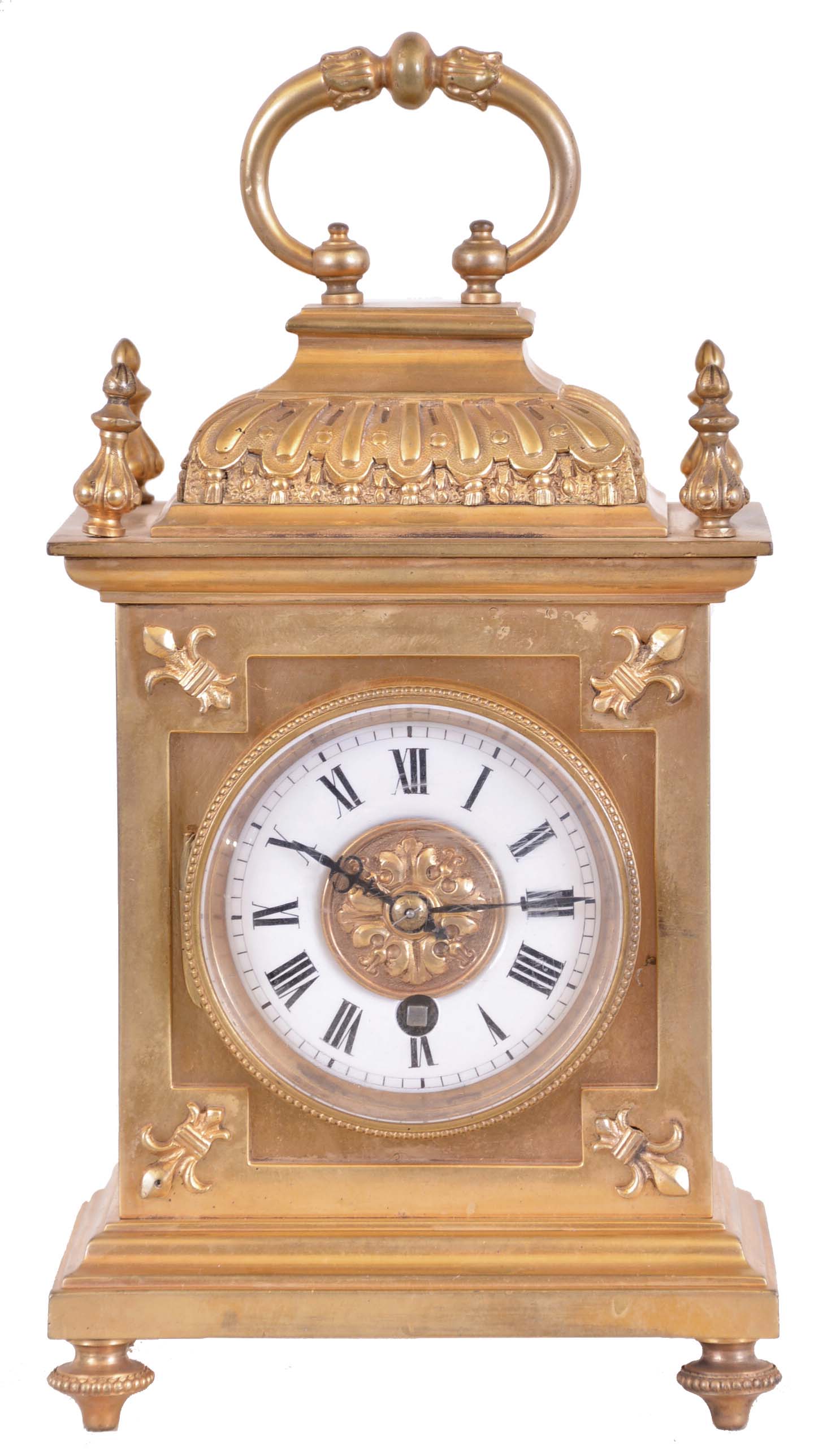 France, gilt bronze desk clock, the decorative case ornamented with fleur de lis, finials, gadrooned cushion to, and carrying handle, Roman numeral white enamel dial, blued steel hands, 8 day timepiece movement with lever platform — Antique Clocks Price Guide