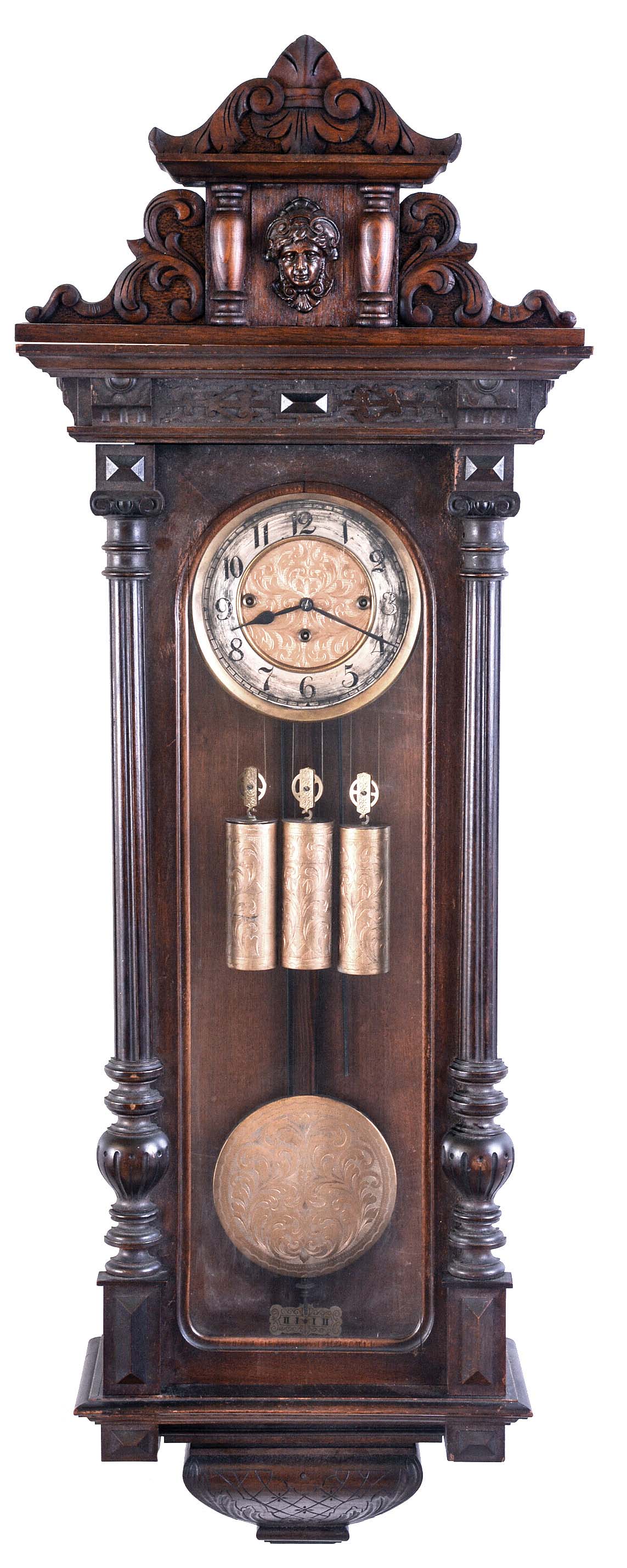 Gustav Becker, Freiburg, Germany, grand sonnerie hanging regulator, walnut case with turned and carved ornament, and frieze with blind fret, Arabic numeral silvered dial with gilt, engraved center, the pendulum, pulleys, and weights also engraved, and 8 day, 3 train movement — Antique Clocks Price Guide