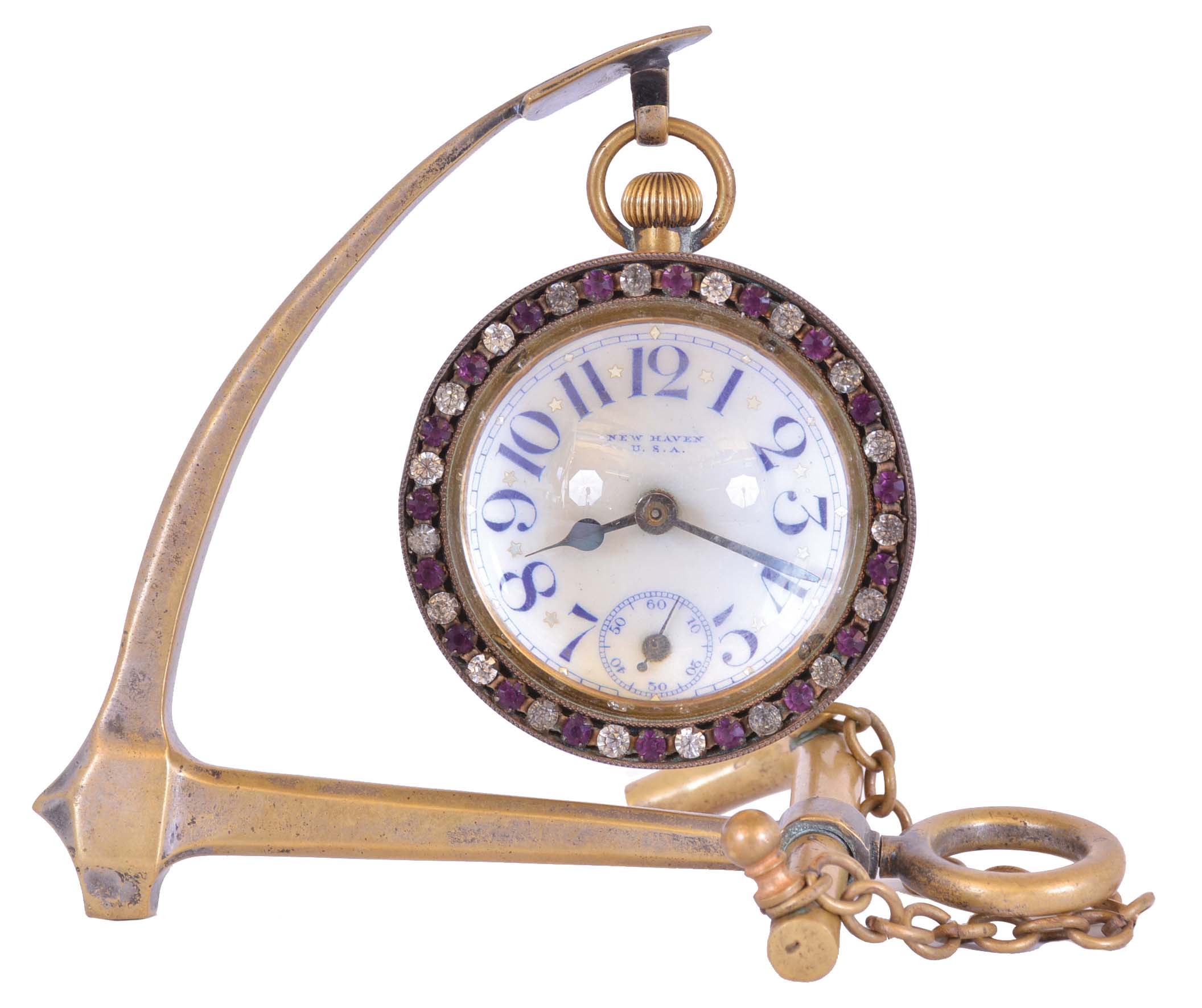 New Haven Clock Co., New Haven, Conn., desk clock with stand, the ball form timepiece with brilliant set bezel, Arabic numeral white enamel dial, and 30 hour pin lever movement, with anchor form brass stand — Antique Clocks Price Guide