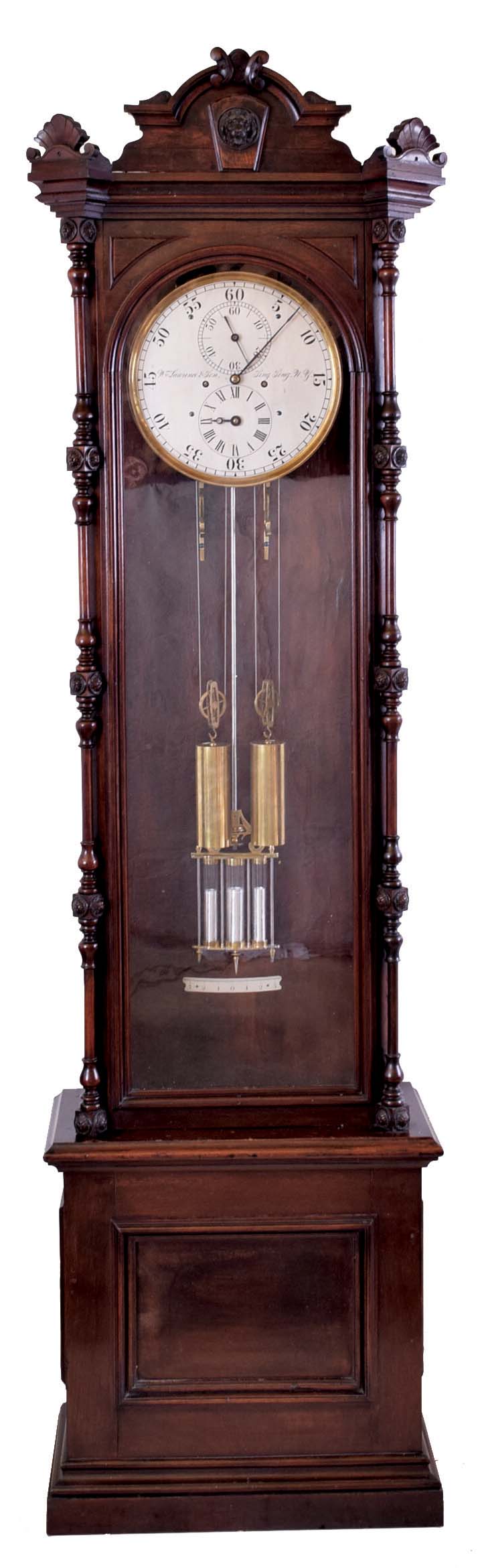 Wm. Lawrence & Sons, Sing Sing, NY, standing astronomical regulator, 8 day, time and strike, two brass weight driven movement with three jar mercury pendulum and pinwheel escapement in a walnut case with carved top and full slender columns flanking door over base with recessed panel and silvered metal dial with maker's signature, backplate dated 1877 — Antique Clocks Price Guide