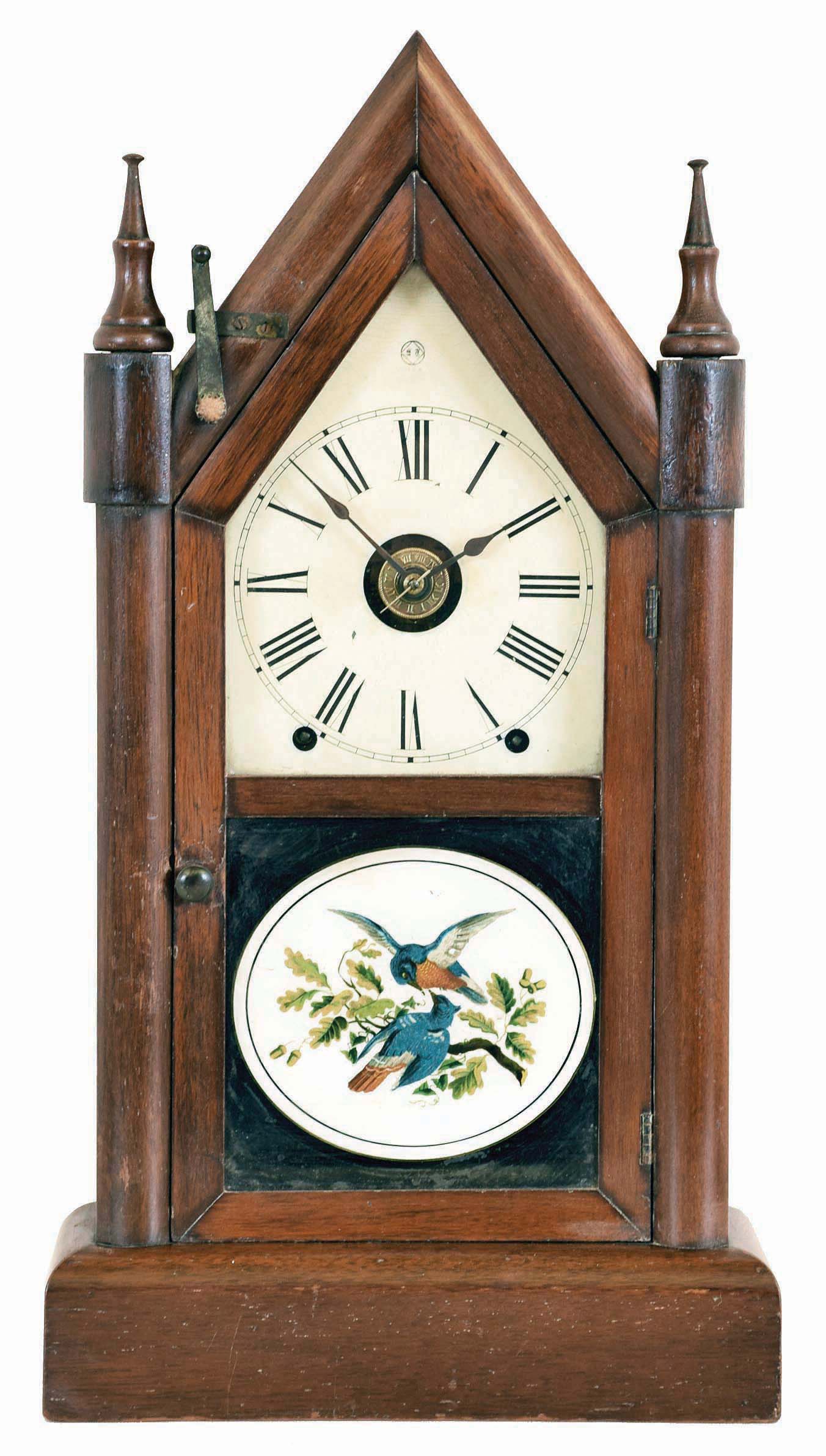 Seth Thomas Clock Co., Thomaston, Conn., "Sharp Gothic" shelf clock with an 8 day spring driven time, strike and alarm movement in a mahogany case. The movement is modified for the Winward Patent (British) Railway Alarm mechanism. — Antique Clocks Price Guide
