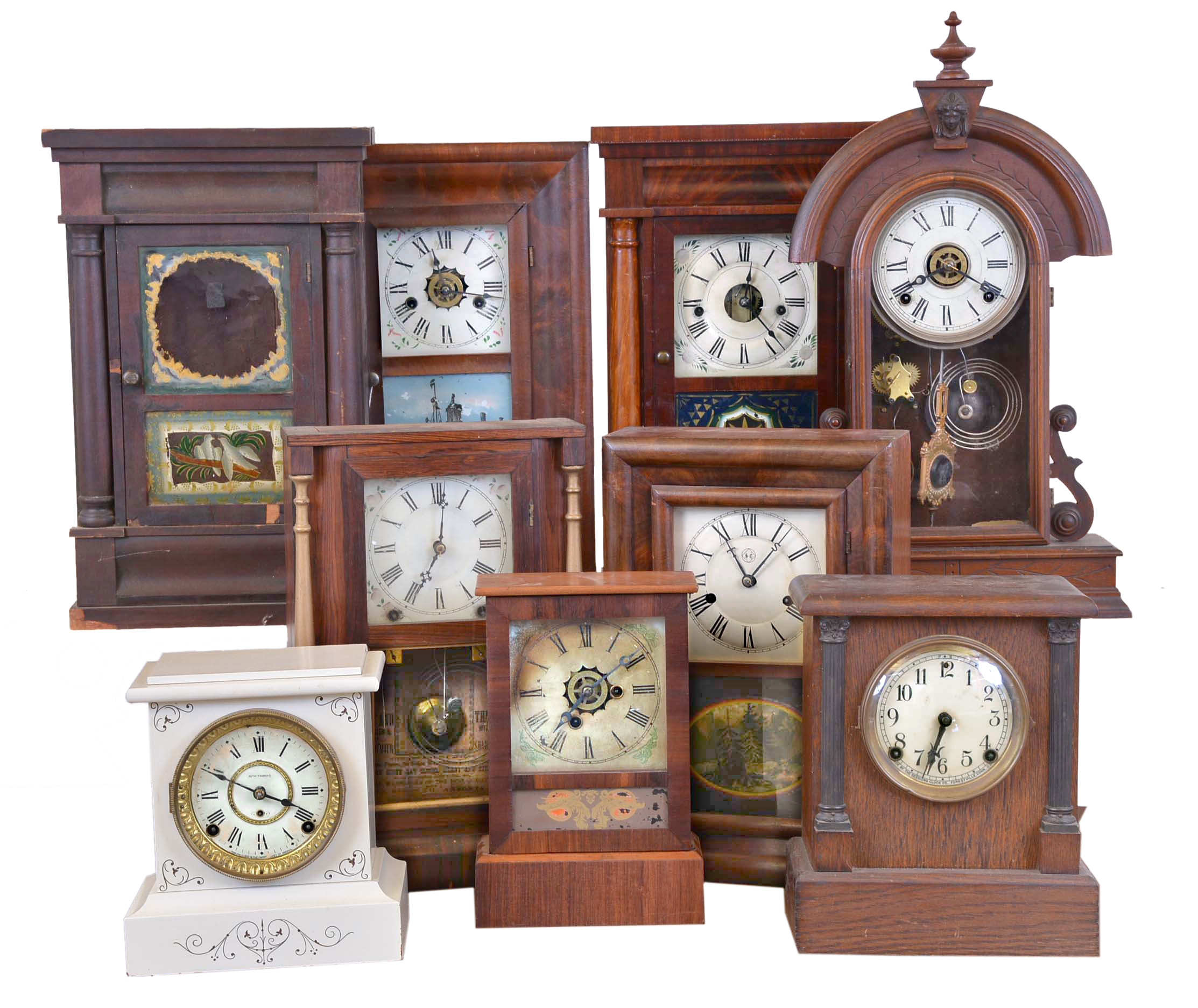 Clocks- 9 (Nine): (1) Seth Thomas Clock Co., Thomaston, Conn., shelf clock with a 30 hour spring driven time and strike movement in a rosewood case, c1890. (2) Ansonia Brass Co., New York, NY, shelf clock with an 8 day spring driven time and strike movement in a rosewood case, c1870. (3) E. N. Welch Mfg. Co., Forestville, Conn., miniature OG shelf clock with a spring driven 30 hour time, strike and alarm movement in a mahogany veneered case, c1880. (4) Seth Thomas Clock Co., Plymouth Hollow, Conn. half column shelf clock with a 30 hour spring driven time and strike movement. c 1855. (5) Sessions Clock Co., Forestville, Conn. shelf clock with a spring driven 8 day time and strike movement in a oak case, c1920. (6) E. N. Welch Clock Co., Forestville, Conn. shelf clock with a spring driven 8 day time, strike and alarm movement in a walnut case, c1890. (7) Unidentified half column clock case with no movement, c1860. (8) E. N. Welch Mfg. Co., Forestville, Conn. cottage shelf clock with a 30 hour spring driven time and alarm movement in a rosewood case, c1870. (9) Seth Thomas Clock Co., Thomaston, Conn., white shelf clock in Adamantine case with a spring driven 8 day time and strike movement, c1910. — Antique Clocks Price Guide