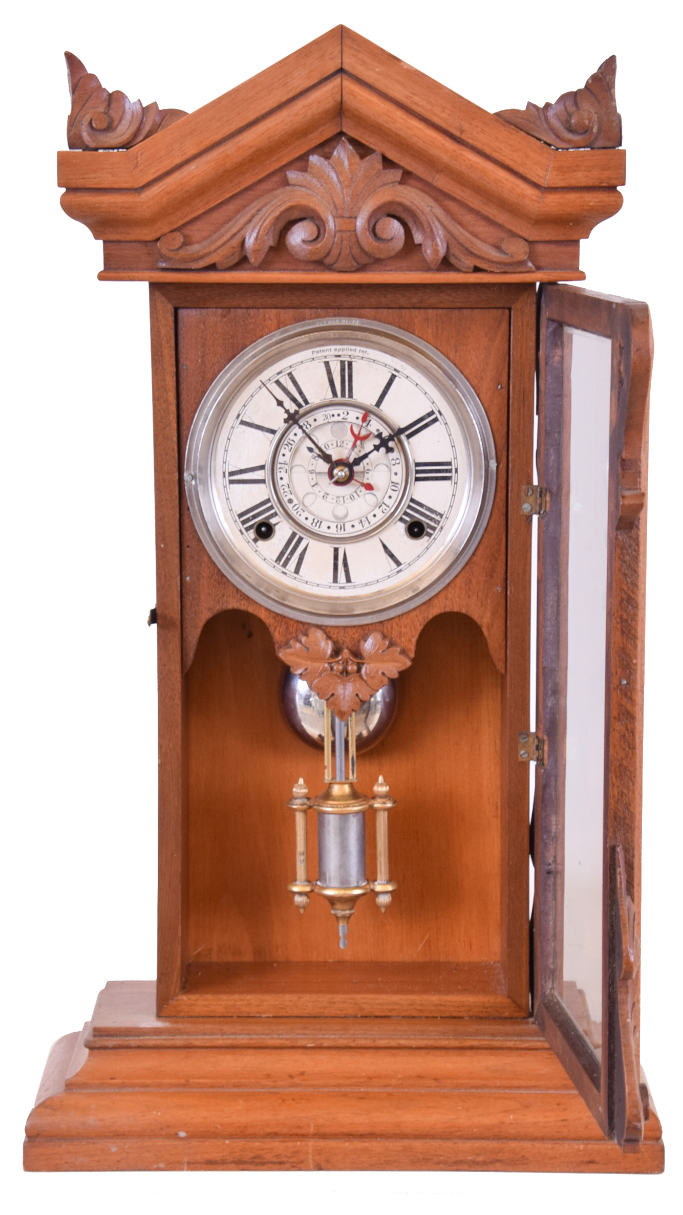 William L. Gilbert Clock Co., Winsted, Conn., 8 day, time and strike spring brass movement unidentified model parlor clock with Dr. Hayden's "Lunar Dial" calendar. — Antique Clocks Price Guide