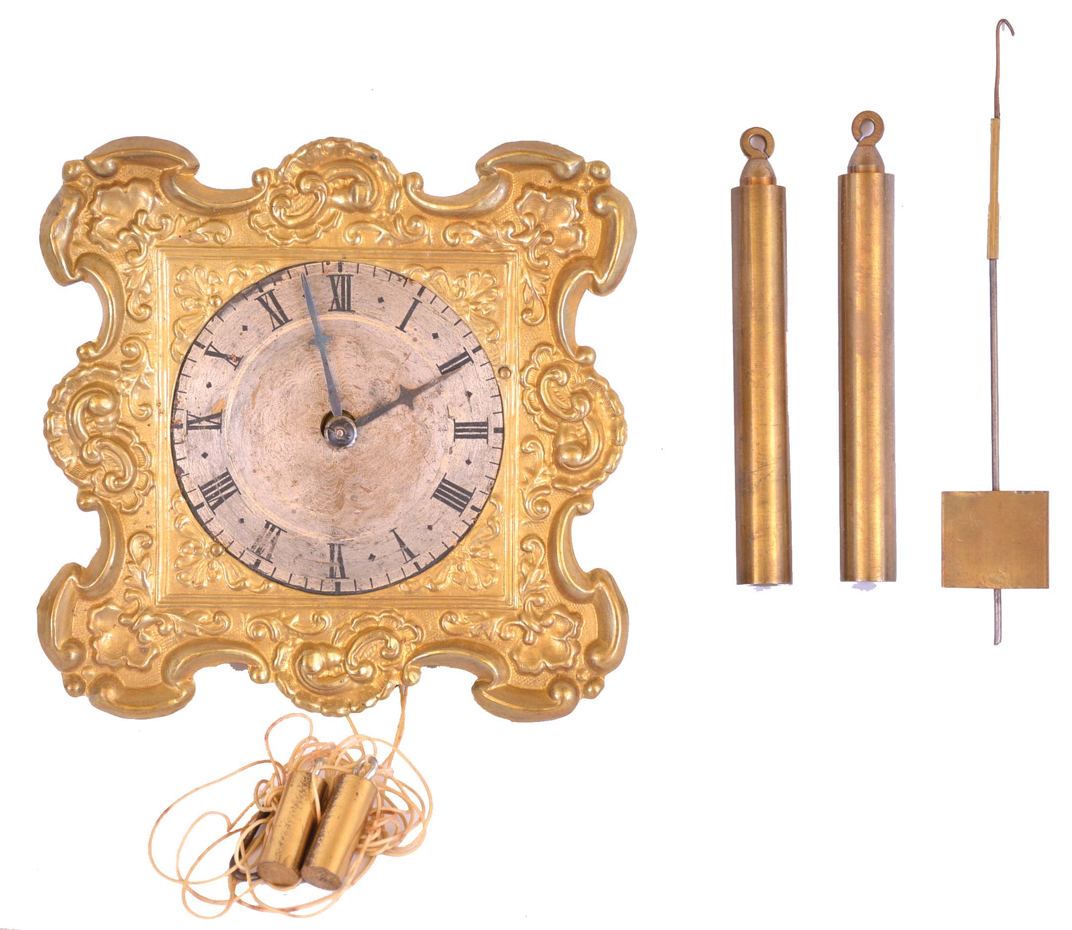 Austria, a small thirty hour wall clock, brass repousse front with silvered Roman numeral dial, blued steel hands, weight driven, rack striking brass movement with pull repeat and square plates, with hook and spikes for hanging — Antique Clocks Price Guide