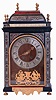 France, Pendule Religieuse, ebonized case with fine moldings and boulle work, the door with pewter fields inlaid with red tortoise shell and engraved brass, glazed case sides with tortoise panels and brass stringing, removable caddy top with inlaid pewter, gilt balustrade, applied bead moldings, and eight flame finials, maroon velvet covered dial with Roman numeral pewter chapter ring, and with cast ornament featuring two seated, classical figures, pierced and engraved brass hands, 8 days time and strike movement, mid 19th century, case with earlier components