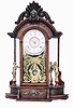 Ansonia Clock Co., New York, NY, "Triumph" mirror side shelf clock with an 8 day, spring driven time and strike brass movement in a walnut case.