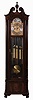 Herschede Clock Co., Cincinnati, Ohio, "Haverford No. 294" hall clock, 8 days, time, strike & chime, three brass weight driven movement playing three tunes on 9 tubes, Westminster, Whittington, Canterbury in a mahogany case with fluted columns with Acanthus carved capitals and bases, cutout base with raised burl panel, bracket feet and beveled glass sides and door, The broken arch top has carved floral rosettes and a finely carved center finial. The brass dial silvered chapter ring and tune and strike / silent selectors, applied cast brass and engraved dial center and spandrels and moon phase, serial no. 628255