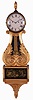 Unsigned New Hampshire or Massachusetts Lyre Banjo hanging clock with a weight driven 8 day time and strike movement in a mahogany and gilt case.