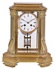 France, for Tiffany & Co., crystal regulator, architectural case with canted corners on a stepped and molded base, the corners decorated with fluted pilasters on inverted corbels, and supporting the stepped, molded top, Roman numeral white enamel dial, blued steel Breguet style hands, 8 day time and strike pendule de Paris movement marked "Tiffany & Co.", with two vial mercury pendulum