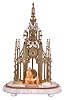 Hutton, Birmingham, Sir Walter Scott memorial skeleton clock, a seated figure of Scott and his dog before the nicely pierced and finished brass frames with Gothic tracery representing the Scott memorial at Edinburgh, Roman numeral, pierced silvered dial, blued steel hands, 8 day fusee timepiece movement with recoil escapement, and turned brass pendulum, all on a variegated white marble base with compressed ball feet