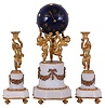 France, mantel clock with garniture, the white marble base with incurved corners, supporting an attenuated column ornamented with gilt floral swags, all surmounted by three dancing putti, holding aloft a blue, painted sphere with gilt Roman numerals and stars, containing an 8 day, time and strike, pendule de Paris movement, the matching garniture also with putti, supporting basket form candle holders