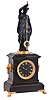 Guilmet, France, mystery clock, black slate case with gilt paw feet and gilt lion mask handles, surmounted by a patinated female figure, her right hand held aloft, and suspending the pendulum, impulsed through the nearly imperceptible movement of the gilt base on which the she stands, Roman numeral slate dial, gilt spade hands, 8 day time and strike movement with Guilmets mark, and numbered 281