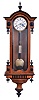 Austria, hanging regulator, walnut case with ebonized moldings, drops, and finial, Roman numeral, two piece white enamel dial, blued steel hands, 8 day timepiece movement with dead beat escapement, brass pendulum with wooden rod, and brass weight
