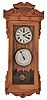 Michael Paul, Berea, Ohio, 30 hour, spring brass pendulum movement with a simple calendar miniature timepiece copy of a New Haven Clock Co. double dial calendar clock. This example is number 16 of 22.